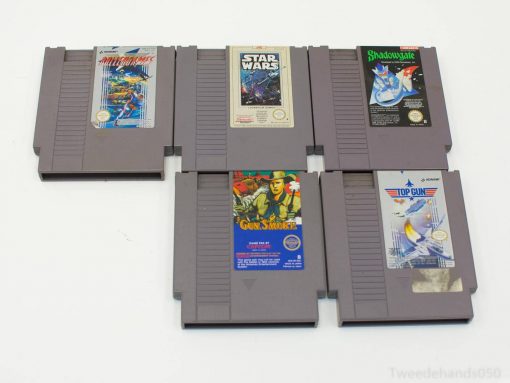 Nostalgic NES cartridges: Millipede, Star Wars, Gunsmoke, Shadowgate, and Top Gun for collectors.