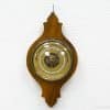 Elegant vintage barometer with wooden frame and glass dome, perfect for stylish weather tracking.