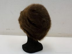 Chic vintage brown fur hat for elegant winter style and timeless fashion appeal.