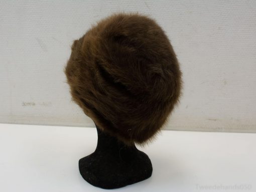Chic vintage brown fur hat for elegant winter style and timeless fashion appeal.