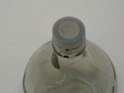 Stylish glass bottle with gray cap, perfect for minimalist decor and beverages.