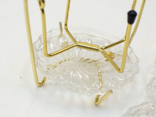 Elegant crystal dish on a gold stand, showcasing exquisite craftsmanship and timeless beauty.