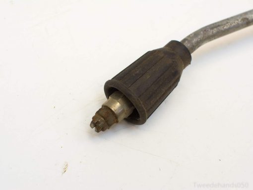 Vintage high-pressure connector with rubber grip, showing wear and character for restoration projects.