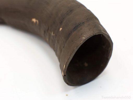 Antique curved horn with rich texture and historical charm, perfect for collectors and decor.