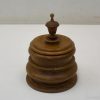 Elegant wooden container with curved layers, perfect for stylish storage and home decor.