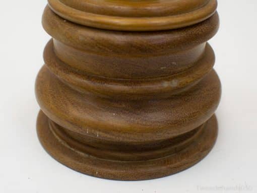 Elegant wooden pedestal with vintage charm, perfect for showcasing candles and decorative accents.