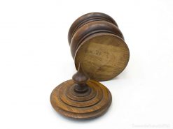 Elegant wooden stacking toy with intricate design and rich grain, perfect for decor or collecting.