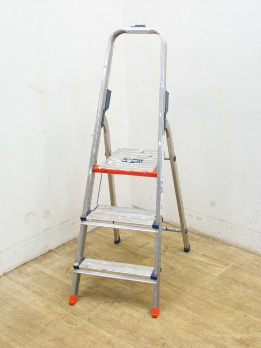 Lightweight three-step aluminum ladder with safety features, perfect for home improvement tasks.