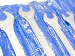 Shiny wrench set in a blue pouch, ideal for mechanics and DIY projects.