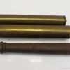 Elegant brass and vintage iron cylinders, ideal for unique home decor with timeless charm.