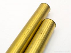 Elegant brass cylinders with a warm sheen and charming imperfections for unique decor.