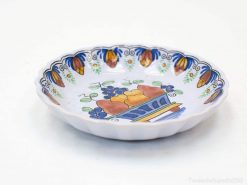 Vibrant handmade ceramic dish with colorful fruit design, ideal for decor and entertaining.