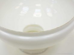 Stylish white bowl featuring a glossy finish and unique imperfections for decorative and multifunctional use.