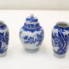 Elegant blue and white porcelain trio with floral designs for refined home decor.