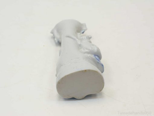 Sleek white porcelain decoration with subtle blue accents, ideal for modern decor and collectors.