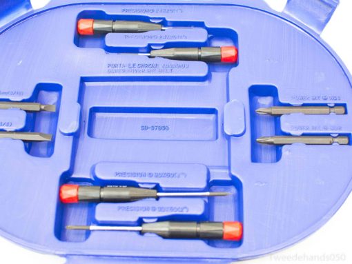 Compact blue screwdriver set with organized bits, perfect for DIY projects and repairs.