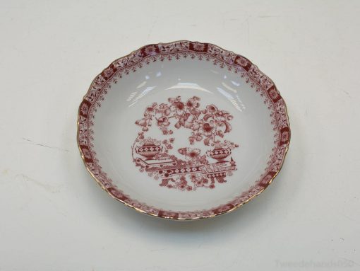 Elegant vintage porcelain dish with floral transferware design, perfect for display or dining.