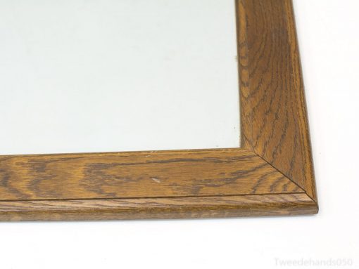 Charming wooden mirror with vintage style and natural finish, enhancing any rooms decor.