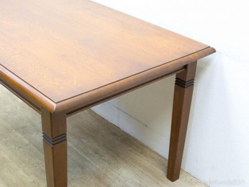 Elegant vintage wooden table with rich finish, rounded edges, and sturdy legs for versatile use.