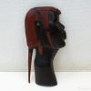 Stylish wooden head sculpture showcasing cultural significance and intricate craftsmanship.