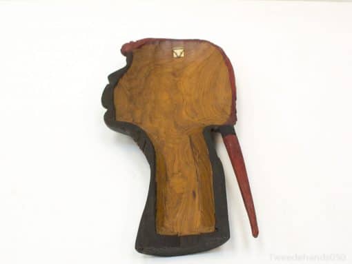 Stylish handcrafted wooden profile wall art with vibrant red accents for unique home décor.