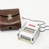 Vintage measuring device and leather case, showcasing classic design and exquisite craftsmanship.