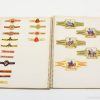 Colorful vintage equestrian labels elegantly displayed in a nostalgic scrapbook collection.