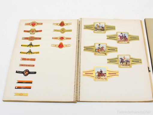 Colorful vintage equestrian labels elegantly displayed in a nostalgic scrapbook collection.