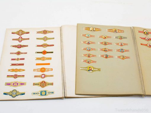 Colorful vintage wristbands in a scrapbook, showcasing intricate designs and cultural history.