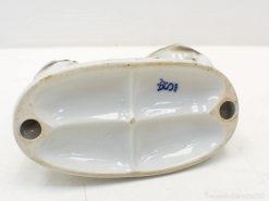 Elegant vintage porcelain bowl with blue markings and four compartments for stylish serving.