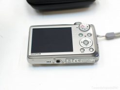 Sleek Fujifilm compact camera with large display, ideal for photographers on the go.