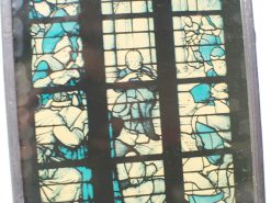 Vibrant stained glass artwork depicting themes of knowledge and spirituality in serene blue tones.