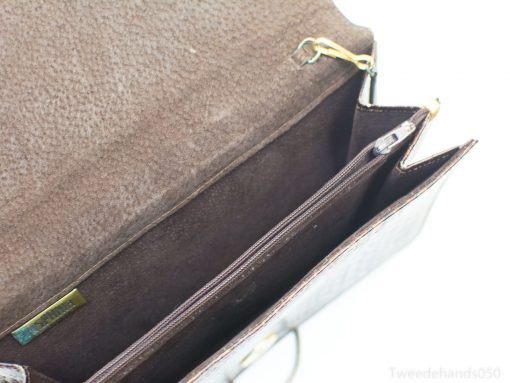 Elegant deep brown leather handbag with luxurious interior and practical compartments for daily use.