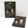 Decorative wooden panels showcasing detailed rural scenes and traditional craftsmanship.