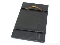 Vintage black wooden chalkboard with twine loop for decorative and creative use.