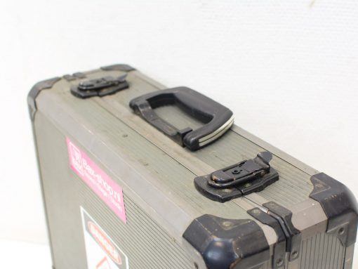 Stylish vintage suitcase with wear and personalized stickers, perfect for adventurous travelers.