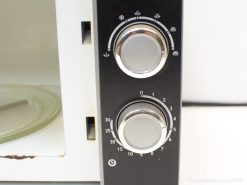 Sleek Quigg microwave with user-friendly dials, perfect for efficient cooking in modern kitchens.