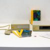 Vintage beige drives with colorful manuals, ideal for retro computing enthusiasts and collectors.