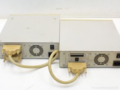 Vintage 90s computer peripherals with distinct ports, ideal for retro tech collectors and enthusiasts.