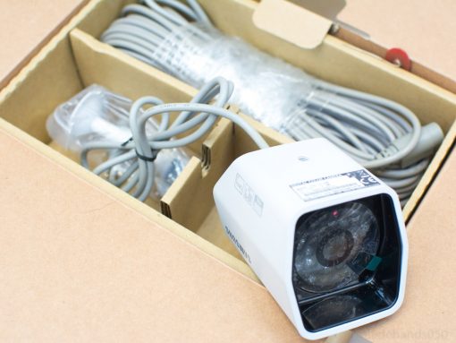 Sleek Samsung security camera kit with organized accessories and cables for effortless installation.