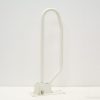 Stylish white metal wall support handle for safety and stability in accessible spaces.