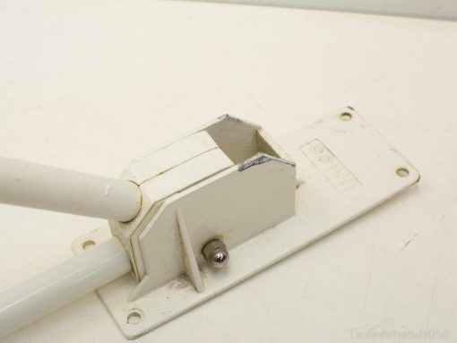 Adjustable cream wall mount for pipes, ideal for secure lighting and banner support.