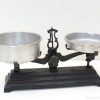 Classic antique balance scale with aluminum bowls, ideal for vintage decor and functional use.