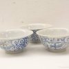 Delicate white porcelain bowls with exquisite blue patterns for elegant dining and decor.