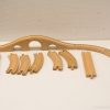 Vintage wooden train set with a stylish bridge for imaginative play and creativity.