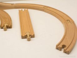 Durable wooden train track set for imaginative play, fostering creativity and motor skills in children.