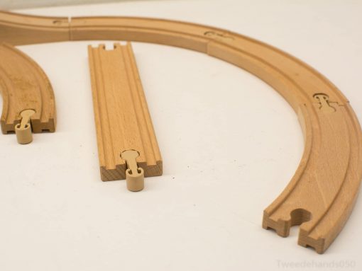 Durable wooden train track set for imaginative play, fostering creativity and motor skills in children.