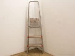 Lightweight four-step aluminum ladder for safe and easy access to elevated areas.