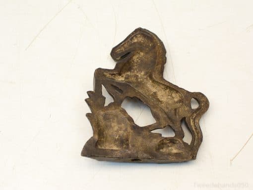 Intricate bronze horse sculpture, perfect for vintage decor, embodies elegance and dynamic charm.