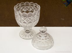 Elegant glass bowl with a decorative lid and diamond pattern, perfect for serving or display.